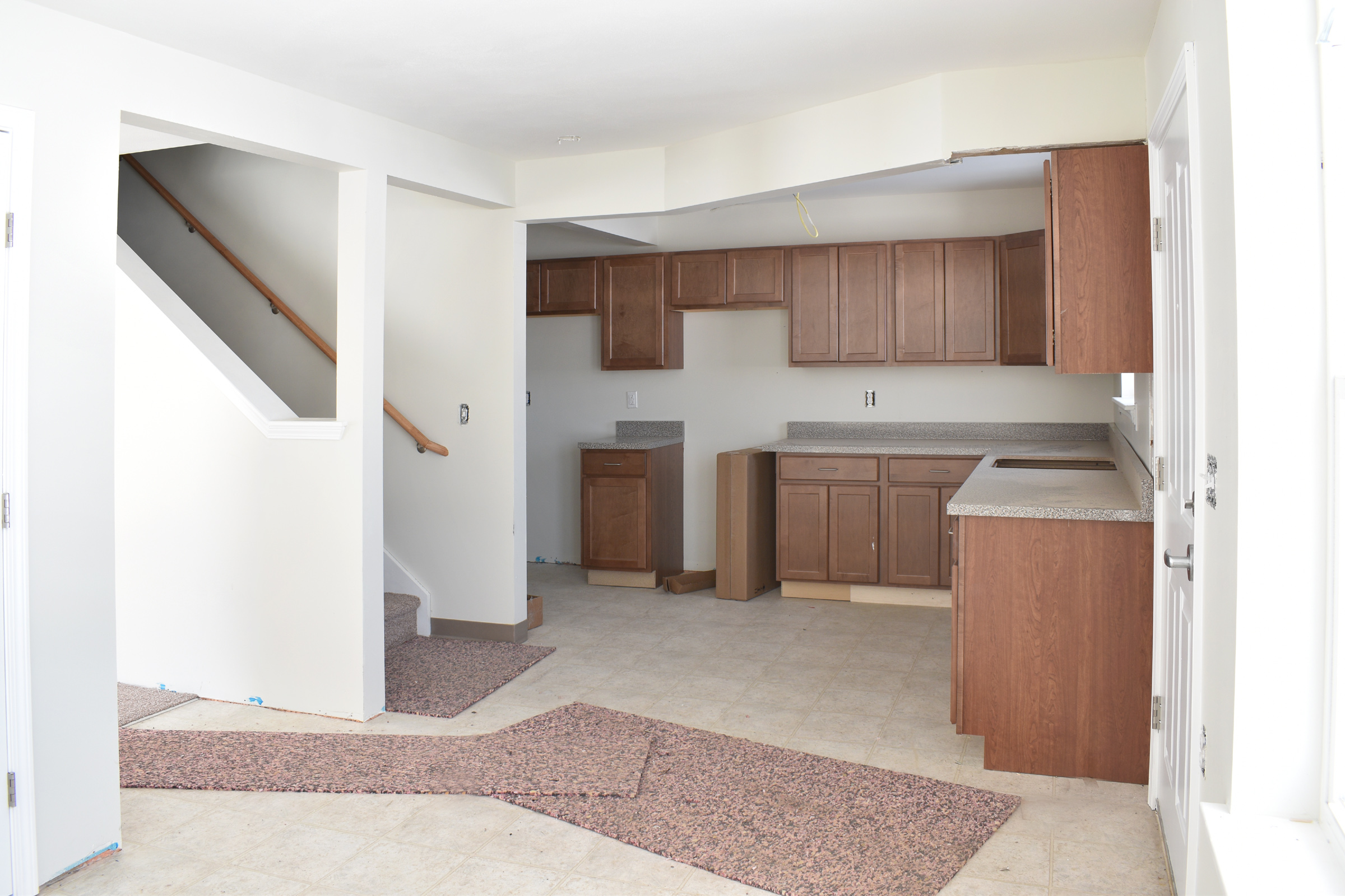 property management company client list syracuse ny kitchen and entryroom image during construction of selkirk townhome