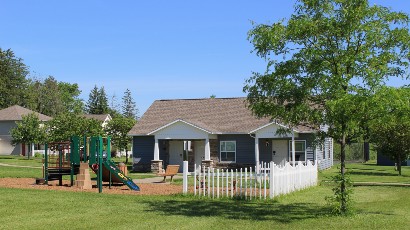 townhomes near auburn ny thumbnail image of Greenview Hills family apartments community office and playground from two plus four management