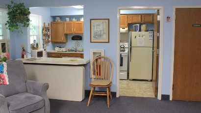 Senior Apartments near Marcellus NY thumbnail image of the nine mile landing apartments community room kitchen from two plus four management