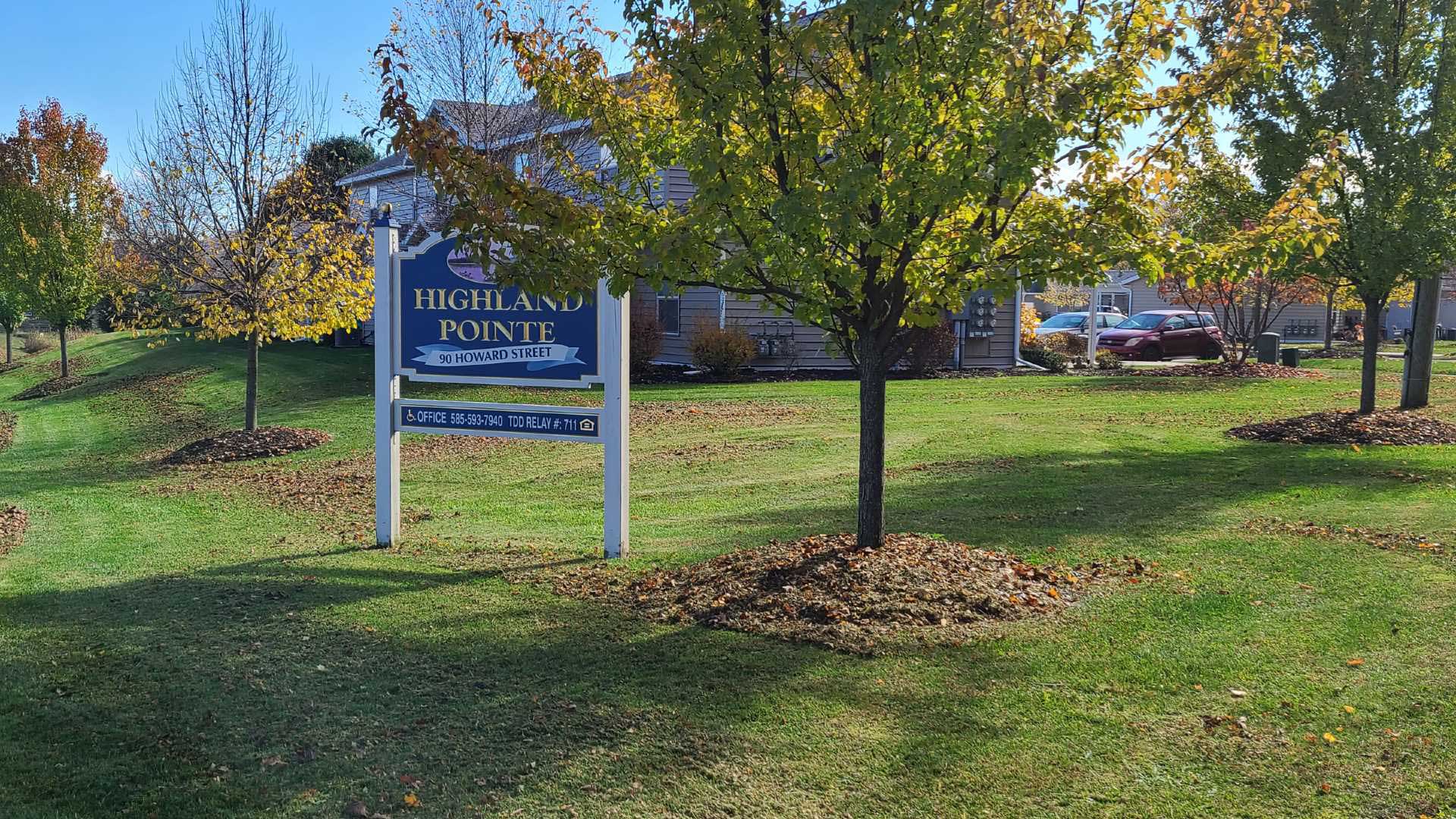 Apartments near Wellsville NY image of highland pointe family apartments welcome sign from two plus four management