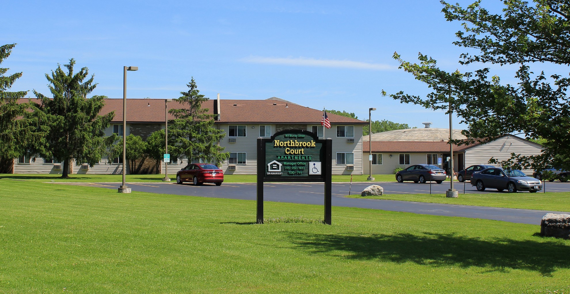 senior apartments near auburn ny image of northbrook court apartments outdoor welcome sign from two plus four management