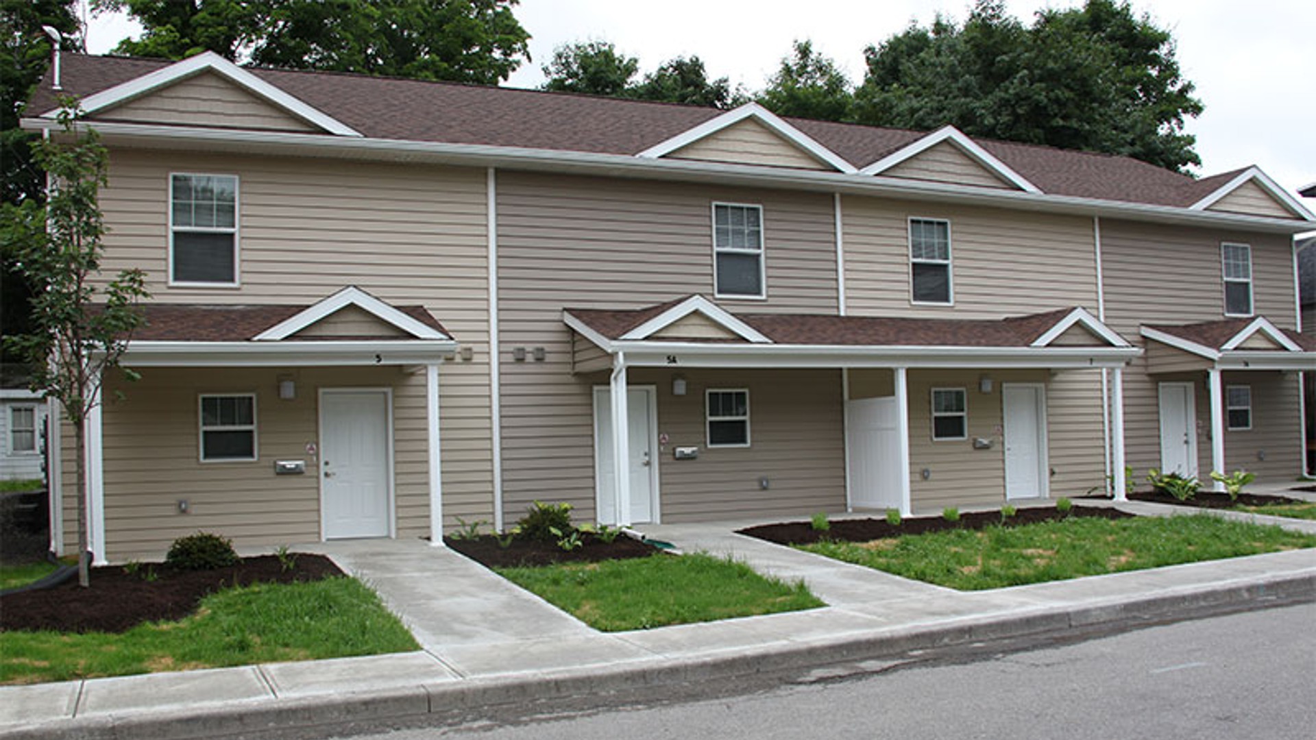 apartments near norwich ny image of the exterior for Cobblers Square family apartments from two plus four management