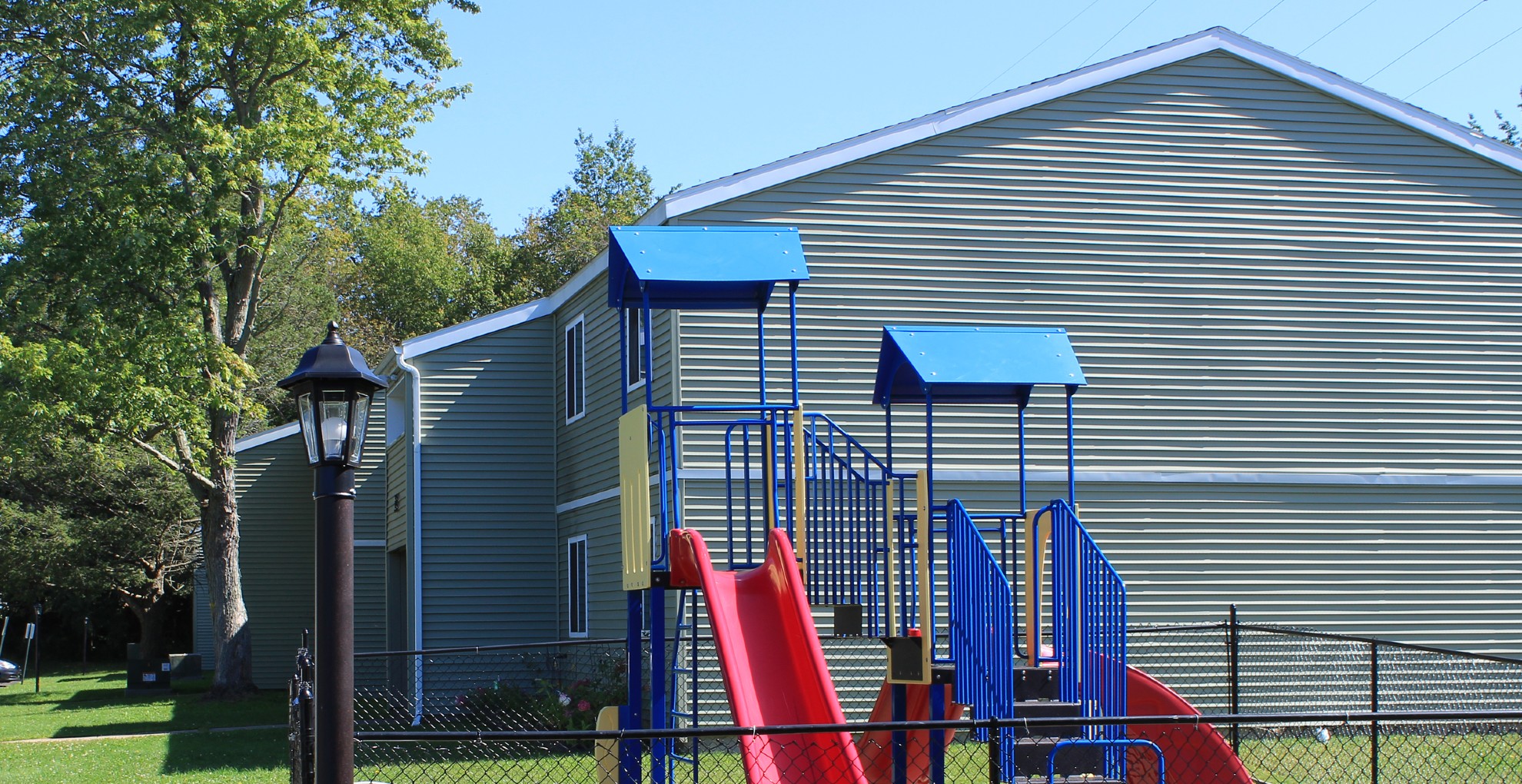 apartments near oswego ny image of wine creek II and III family apartment playground from two plus four management