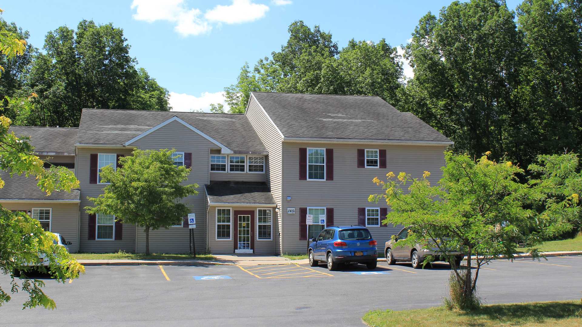 Senior Housing near Camillus NY image of connelly acres apartments exterior from two plus four property management