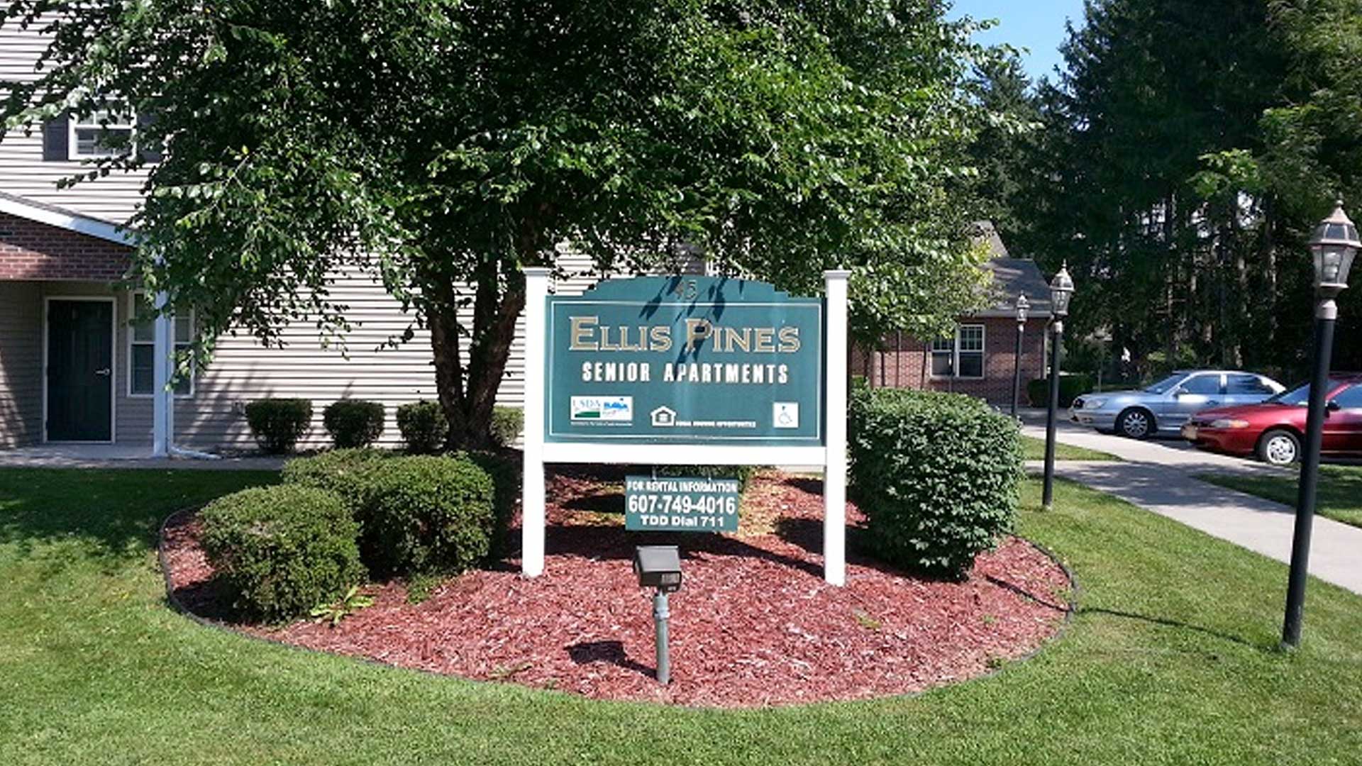 Senior Apartments near Homer NY image of ellis pines apartments welcome sign from two plus four property management