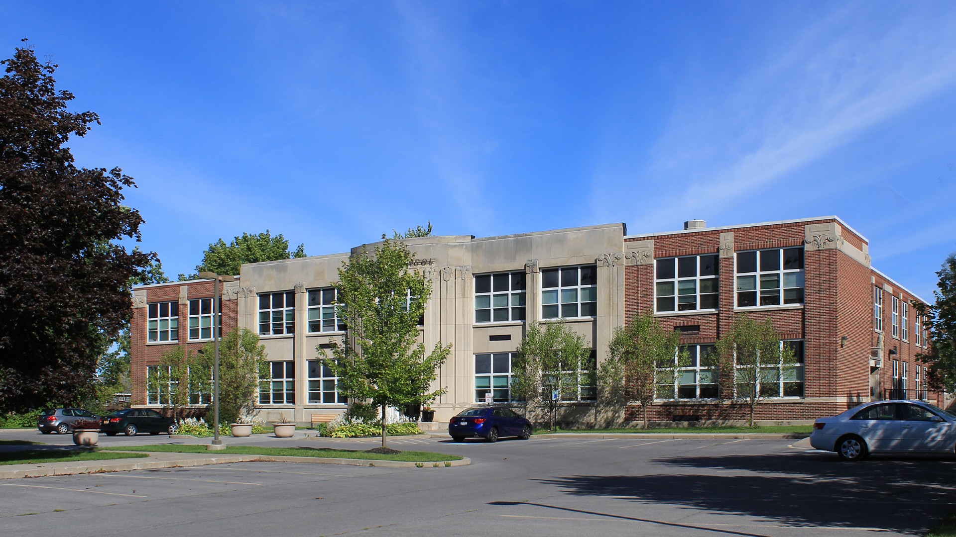 Senior Apartments near East Syracuse NY thumbail image of heman street school apartments from two plus four management