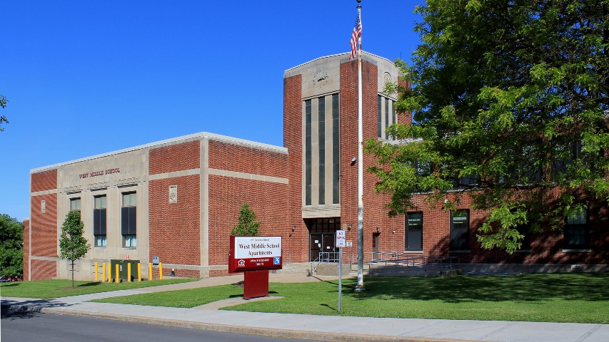 Rent Apartments near Auburn NY exterior view of west middle school family apartments 217 genesee street office 315-252-0682 tdd-711 from two plus four management