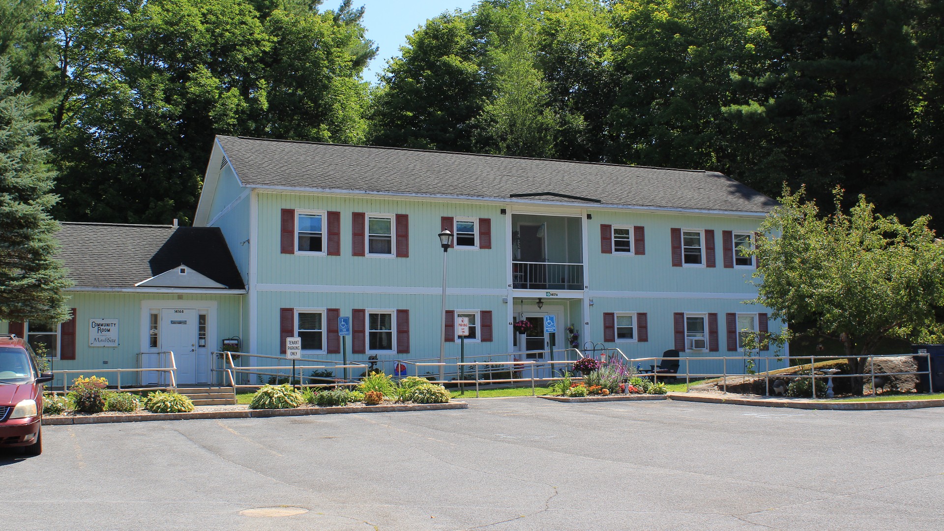 Senior Apartments near Harrisville NY exterior view of harris court apartments from two plus four management