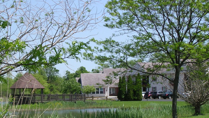 Senior Housing near East Syracuse NY exterior image of colonial village senior apartments from two plus four management