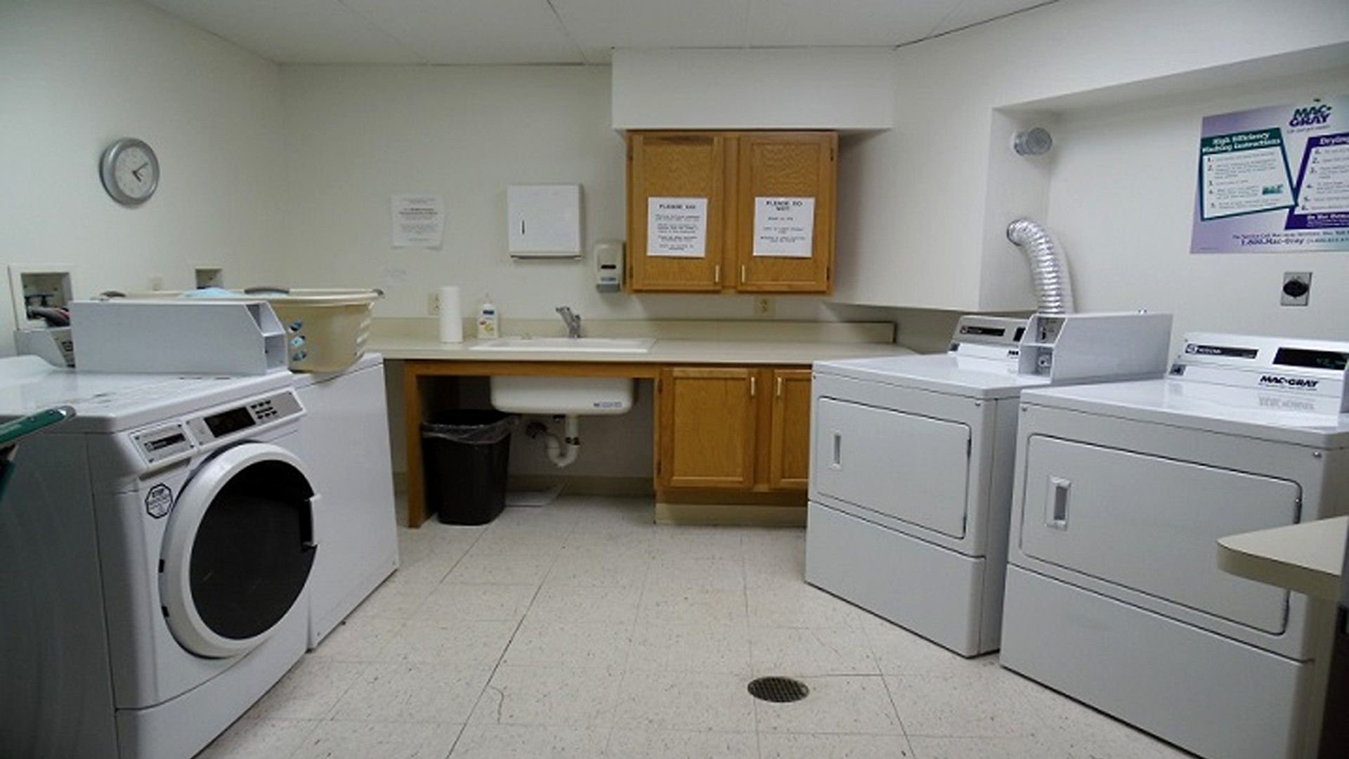 Senior Housing near East Syracuse NY image of colonial village senior apartments community laundry room from two plus four management