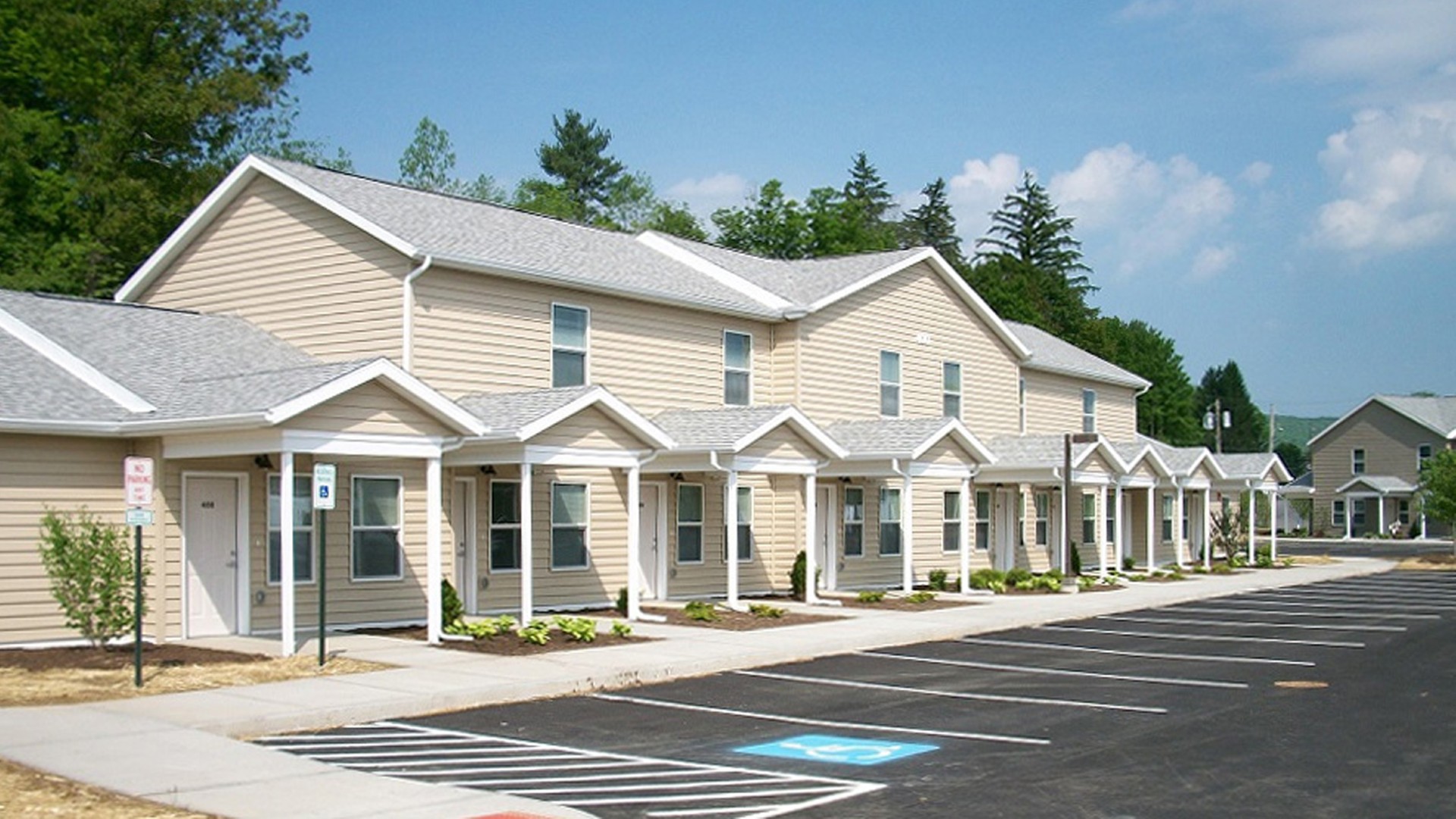 Apartments near Wellsville NY exterior view of highland pointe family apartments from two plus four management