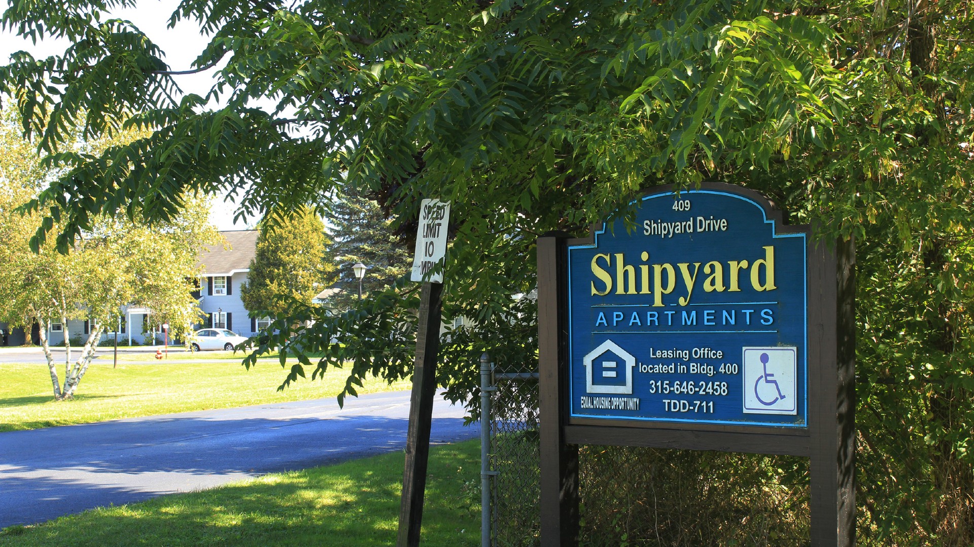 Apartments near Sackets Harbor NY 409 shipyard drive shipyard apartments image of leasing office located in building 400 equal housing opporturtunity sign