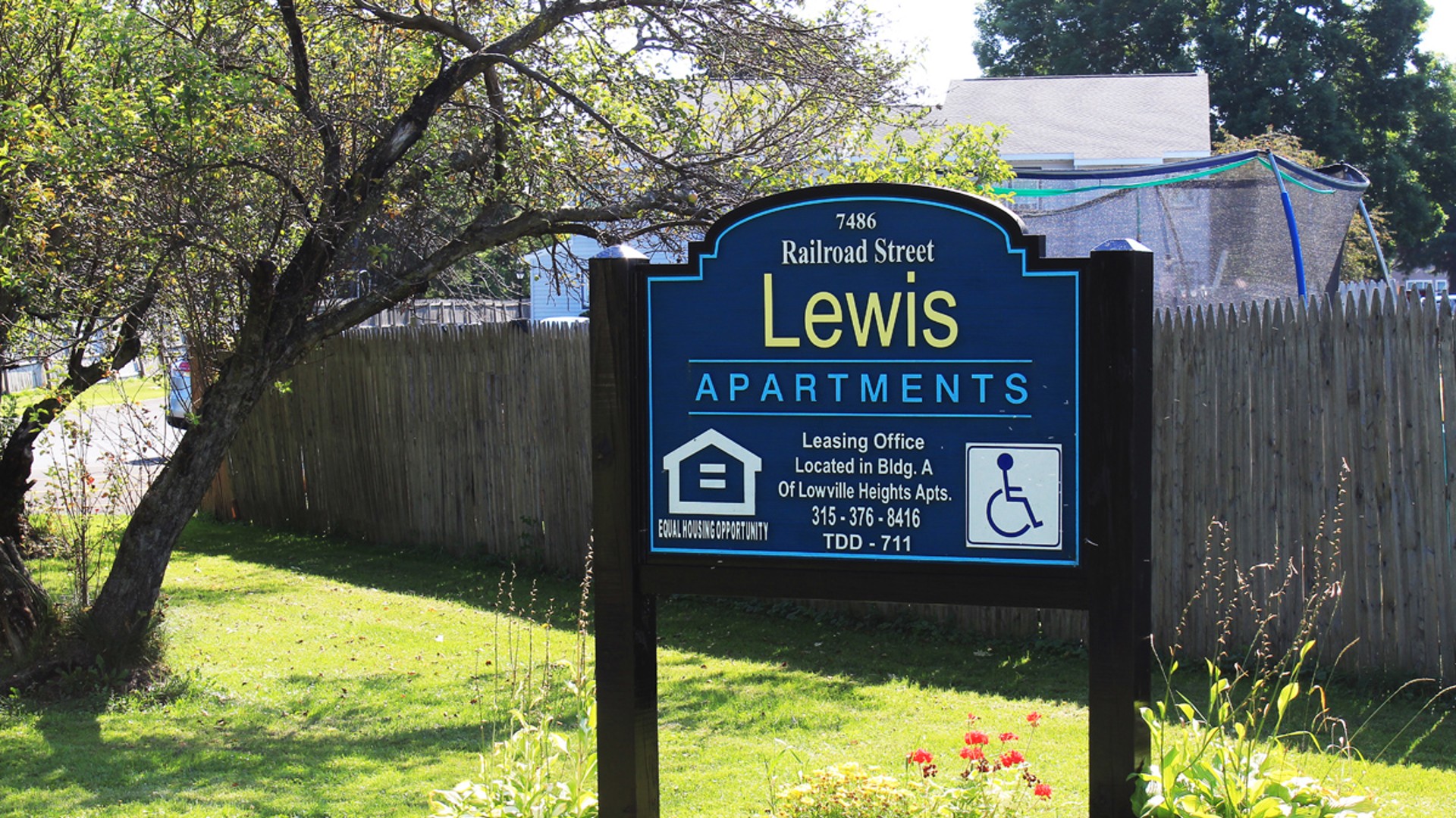 Apartments near Lowville NY image of lewis and lowville heights family apartments welcome sign from two plus four management