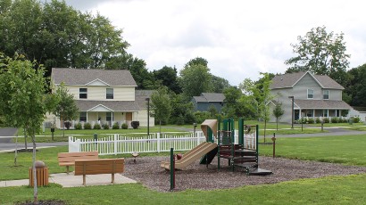 townhomes near auburn ny thumbnail image of Greenview Hills family apartments playground from two plus four management