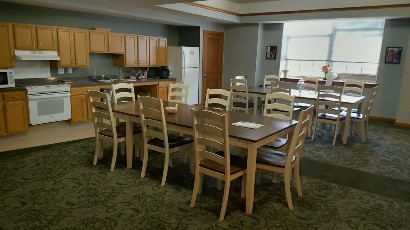 Senior Apartments near Watkins Glen NY thumbnail image of watkins glen school apartments community room kitchen from two plus four management