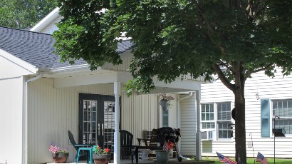 Senior Housing near Marcellus NY thumbnail image of upper crown landing patio from two plus four management