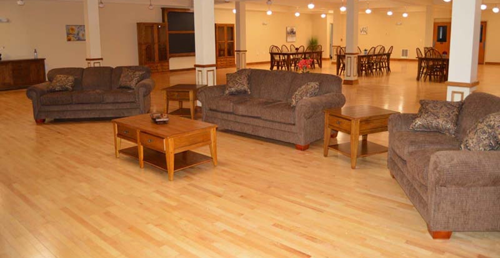 Rent Apartments near Auburn NY image of west middle school family apartments community area living room from two plus four management