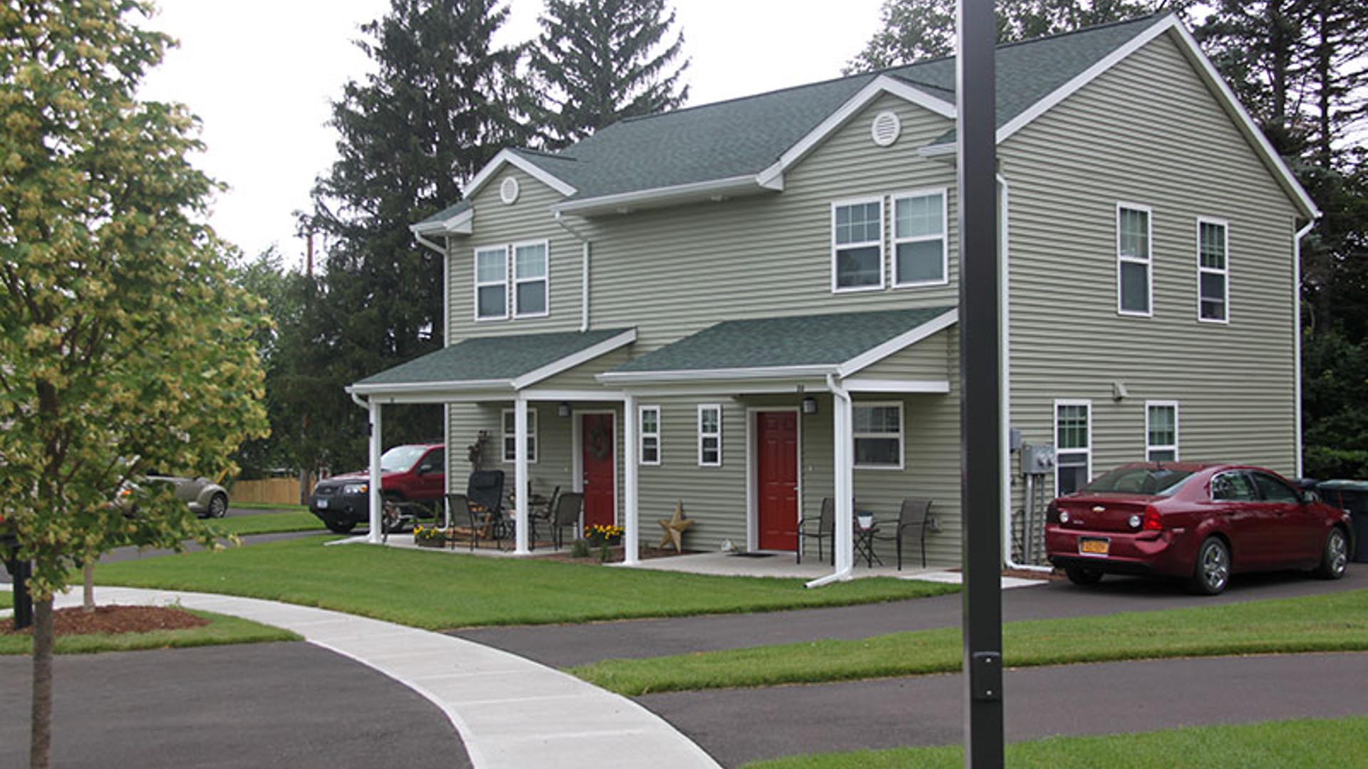 Apartments near Sidney NY thumbnail image of the street view sherwood landing apartment entrance for two plus four management