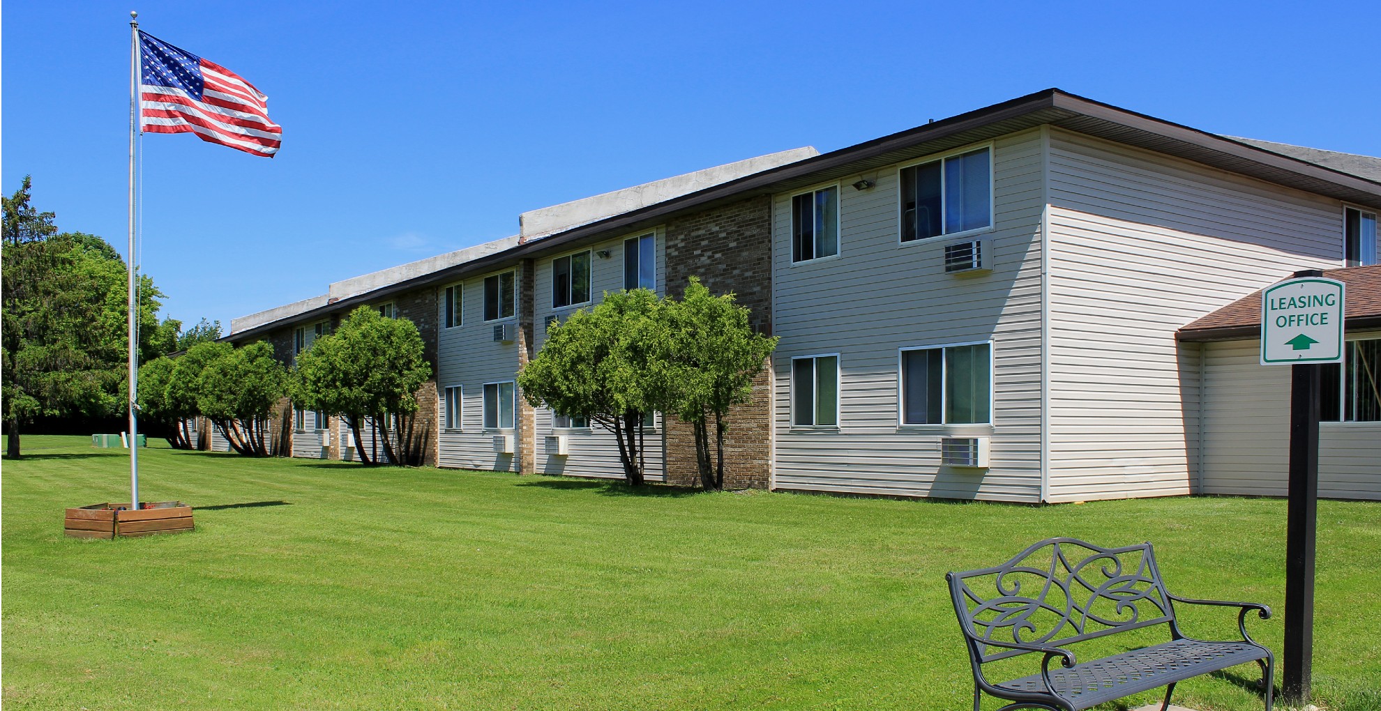 senior apartments near auburn ny exterior view of northbrook court apartments leasing office sign from two plus four management