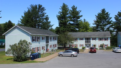 Senior Apartments near Harrisville NY thumbnail image of harris court apartments with parking from two plus four management