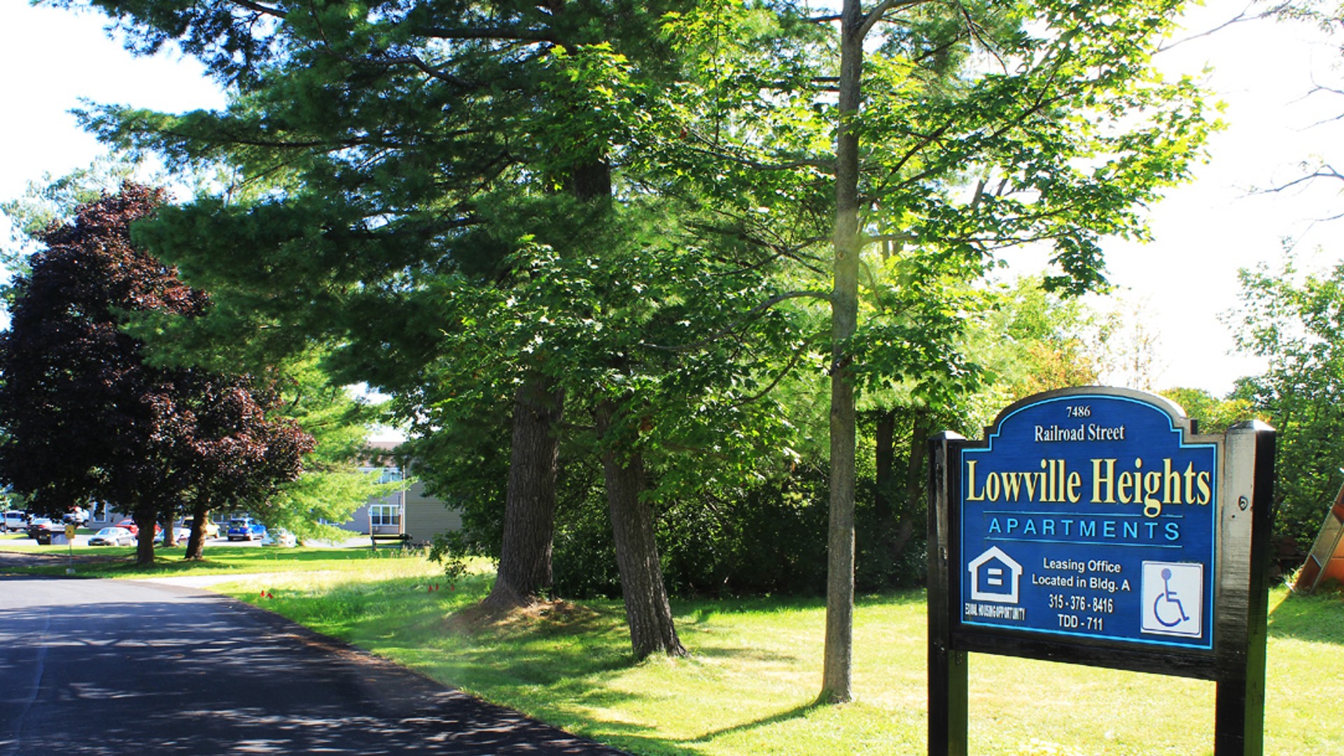 Apartments near Lowville NY image of lewis and lowville heights family apartments outdoor sign from two plus four management