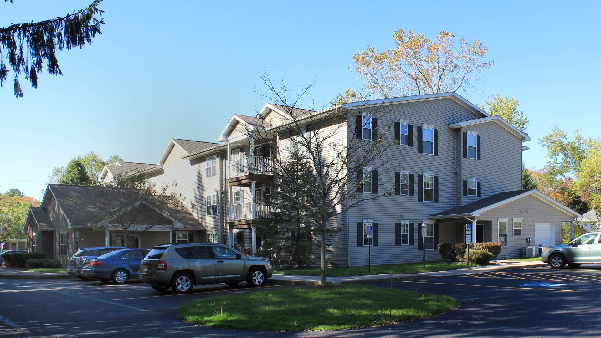 Senior Apartments near Homer NY exterior view of ellis pines apartments from two plus four property management