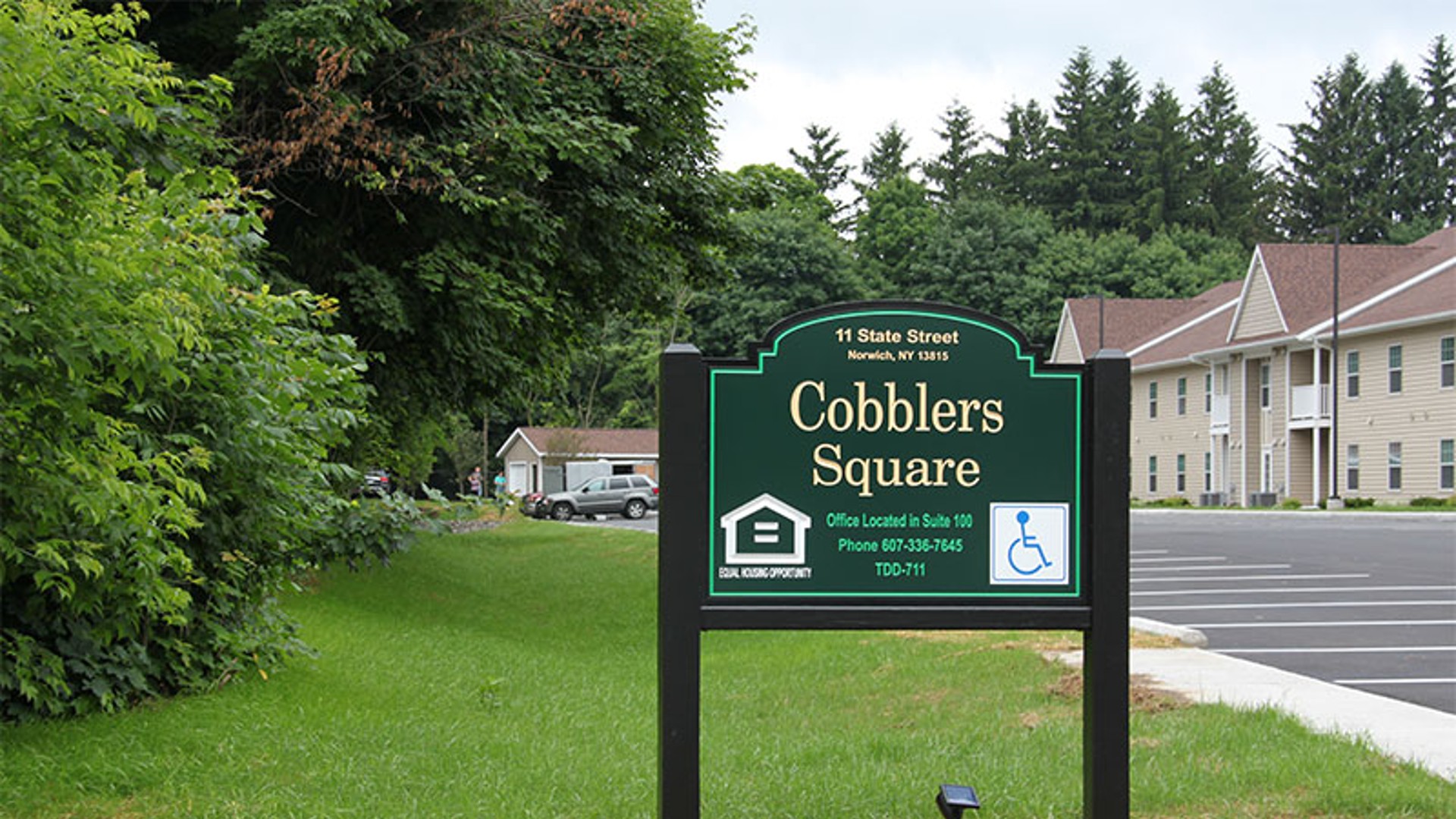 apartments near norwich ny image of the outdoor sign call 607-336-7645 suite 100 tdd-711 accessible for Cobblers Square family apartments from two plus four management