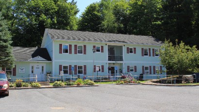 Senior Apartments near Harrisville NY thumbnail image exterior view of harris court apartments from two plus four management