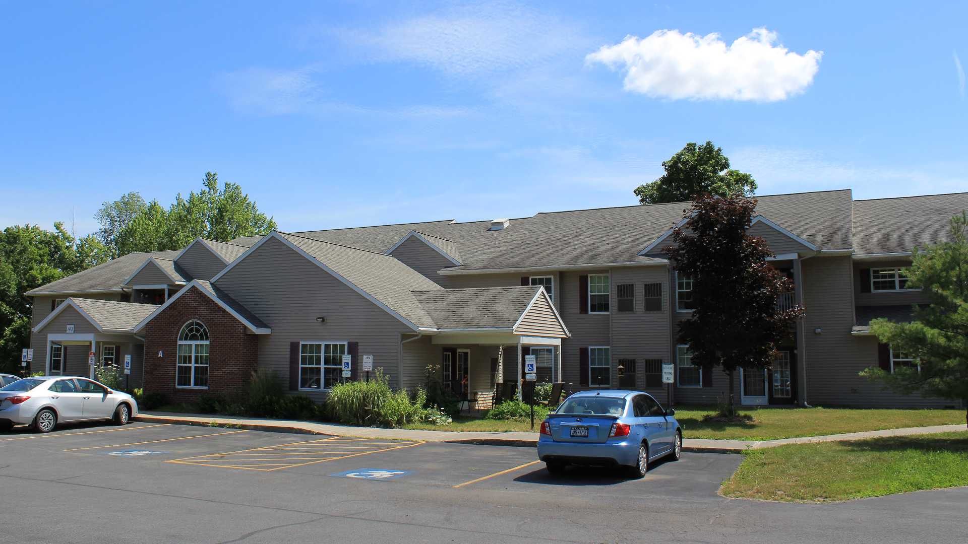 Senior Housing near Camillus NY image of connelly acres apartments with parking from two plus four property management