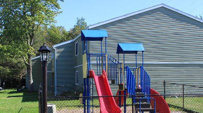 apartments near oswego ny thumbnail image of wine creek II and III family apartment playground from two plus four management