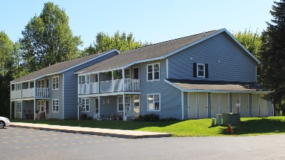 Apartments near Sackets Harbor NY thumbnail image of street view for shipyard family apartments with playground for two plus four management