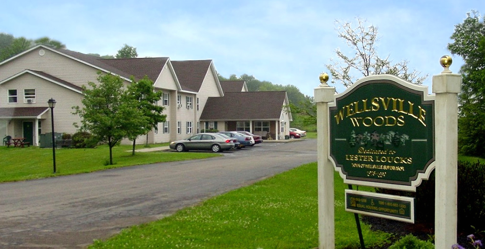 Senior Apartments near Wellsville NY exterior view of Wellsville Woods Senior Apartments from two plus four management