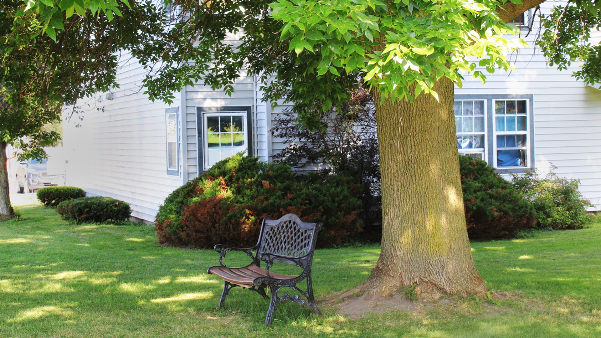 Apartments near Lowville NY image of lewis and lowville heights family apartments backyard bench from two plus four management