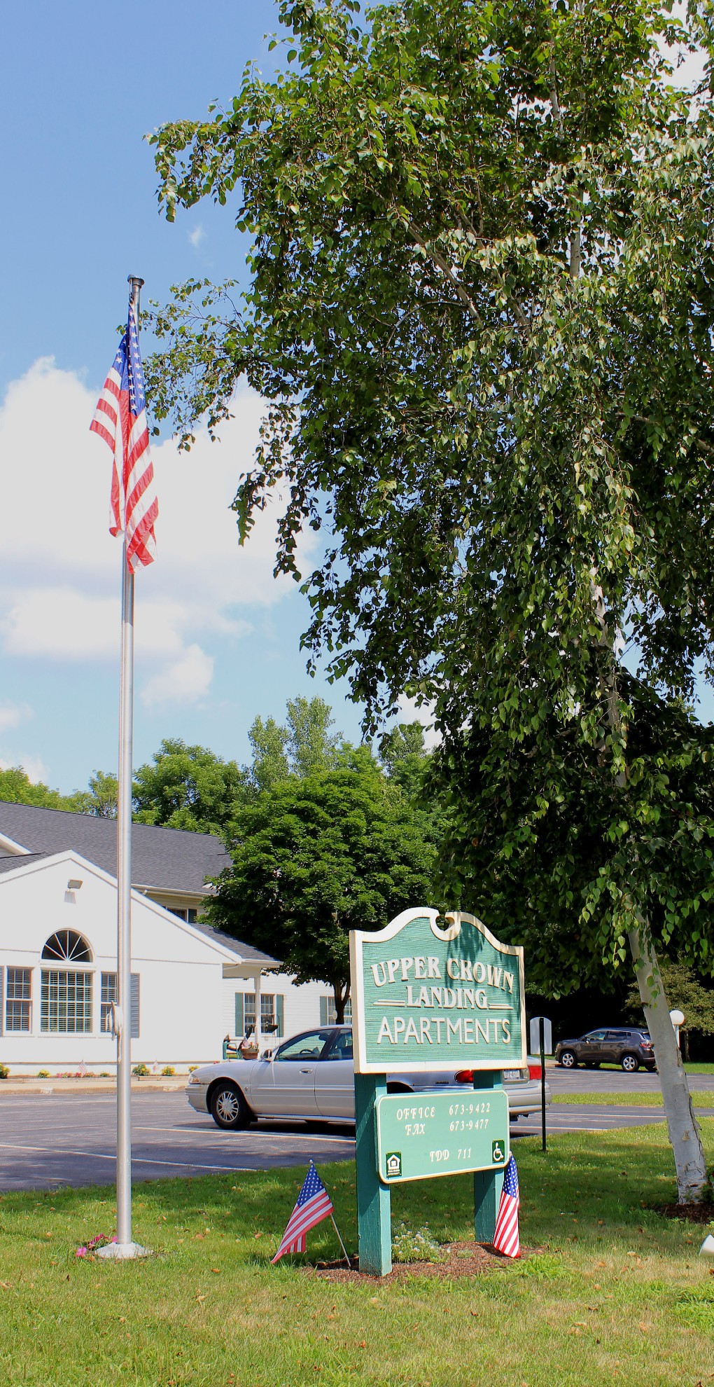 Senior Housing near Marcellus NY image of upper crown landing outdoor sign from two plus four management