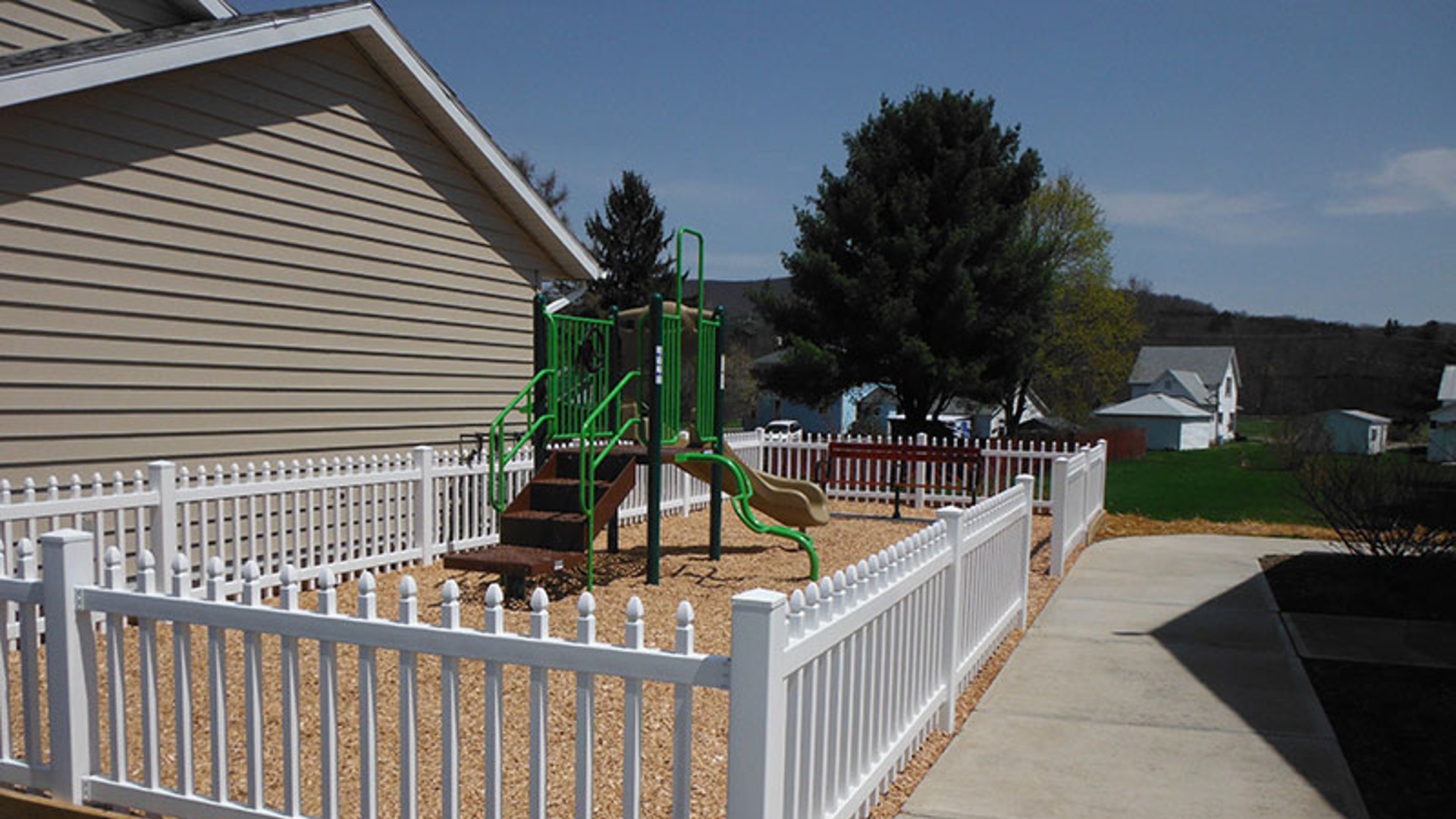 Apartments near Wellsville NY image of highland pointe family apartments playground from two plus four management