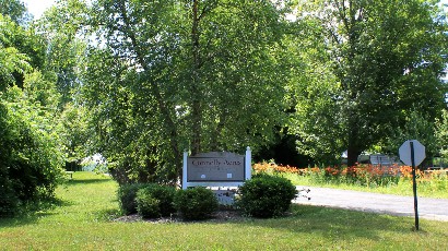 Senior Housing near Camillus NY thumbnail image of connelly acres apartments welcome sign from two plus four property management