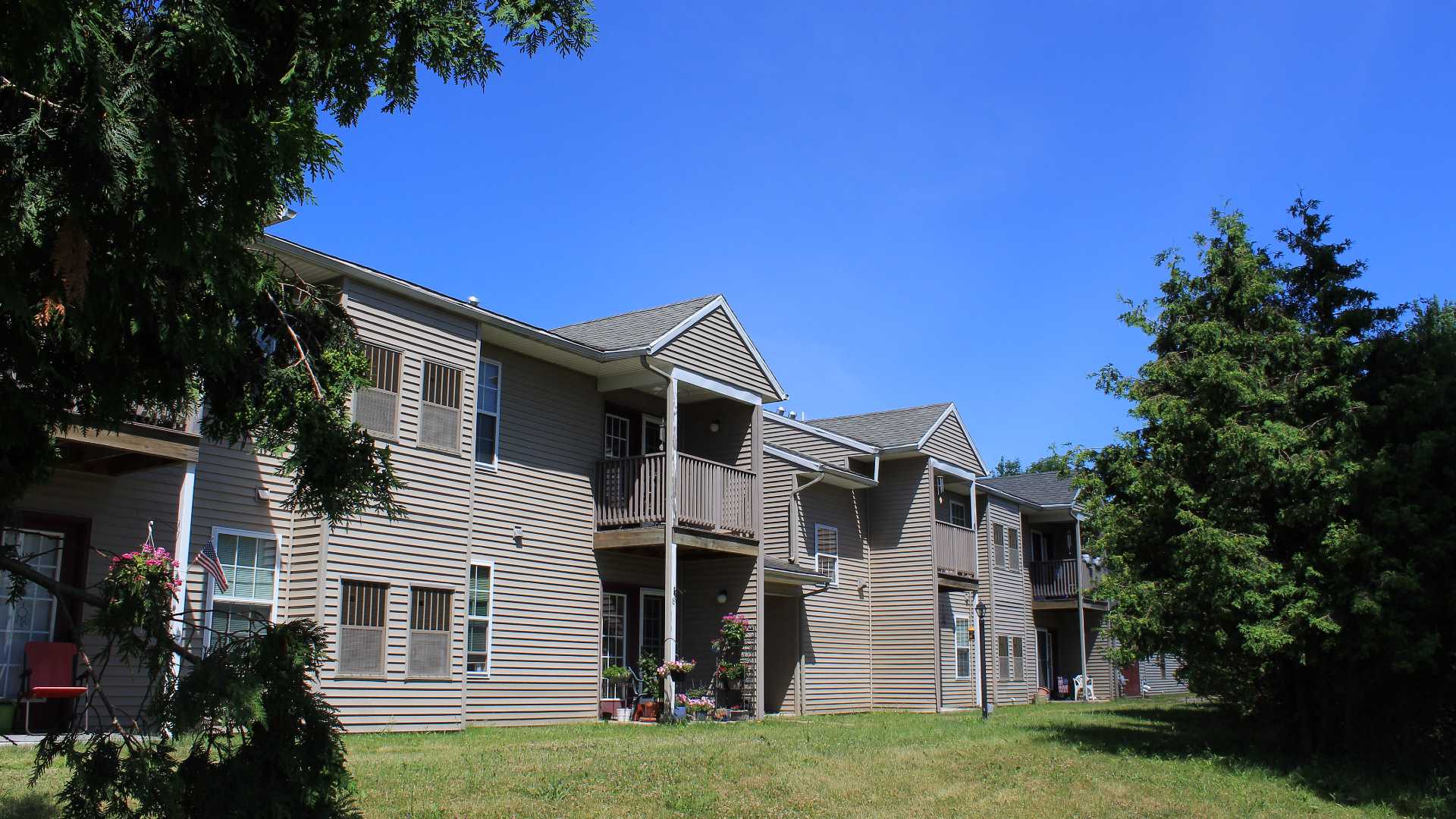 Senior Housing near Camillus NY image of connelly acres apartments rear view from two plus four property management