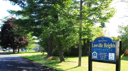 Apartments near Lowville NY thumbnail image of lewis and lowville heights family apartments outdoor sign from two plus four management