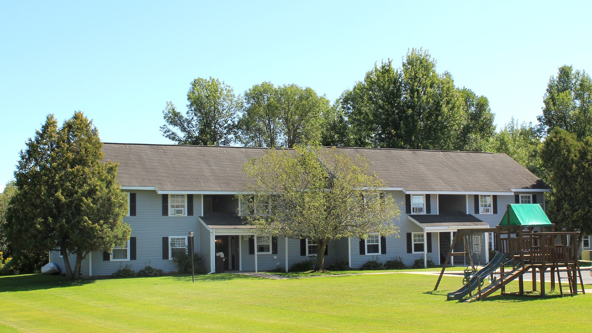 Apartments near Sackets Harbor NY image of shipyard family apartments with playground for two plus four management