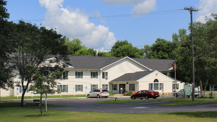 Senior Housing near Marcellus NY exterior image of upper crown landing from two plus four management