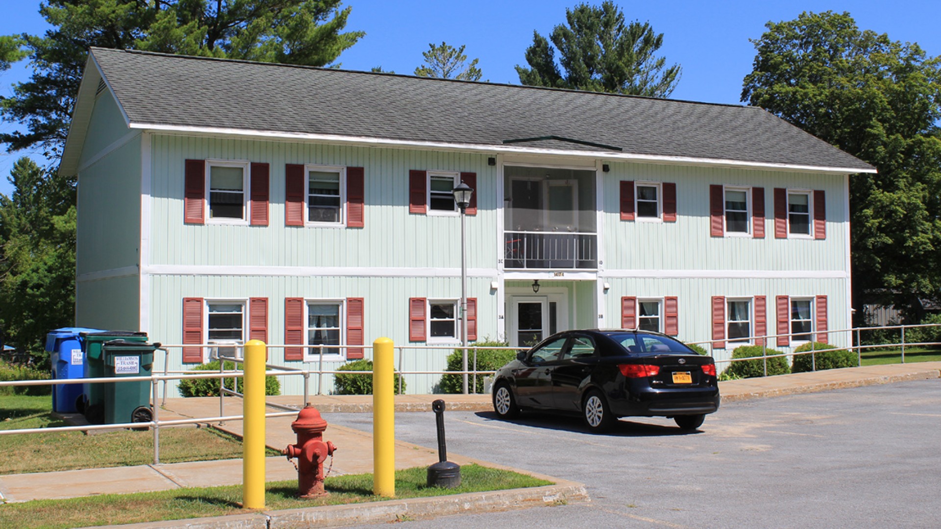 Senior Apartments near Harrisville NY image of harris court apartments from two plus four management