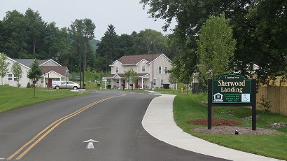 Apartments near Sidney NY thumbnail image of sherwood landing apartment entrance for two plus four management