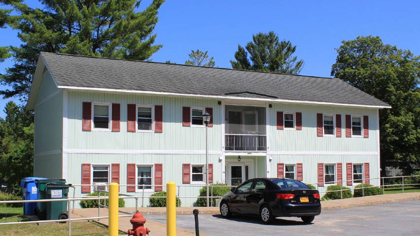 Senior Apartments near Harrisville NY front view of harris court apartments from two plus four management