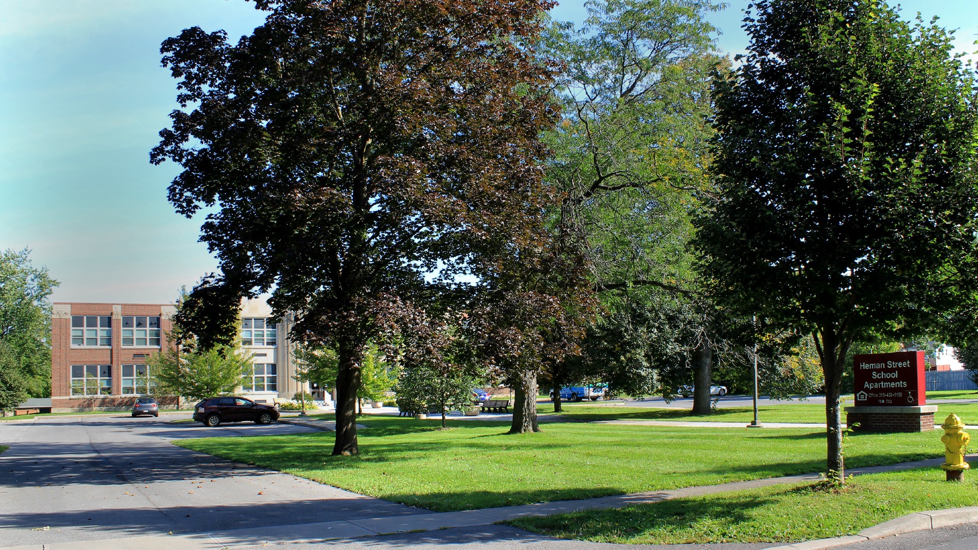 Senior Apartments near East Syracuse NY image of heman street school apartments entrance from two plus four management