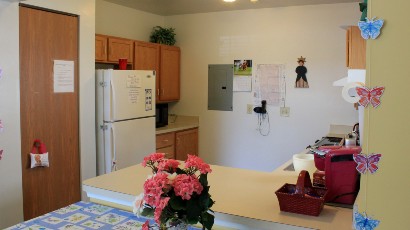 Senior Housing near Marcellus NY thumbnail image of upper crown landing community kitchen from two plus four management