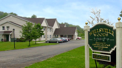 senior apartments near wellsville ny thumbnail image of wellsville woods senior apartments exterior with welcome sign from two plus four management