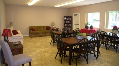 Senior Apartments near Avon NY thumbnail image of community manor II community room from two plus four management