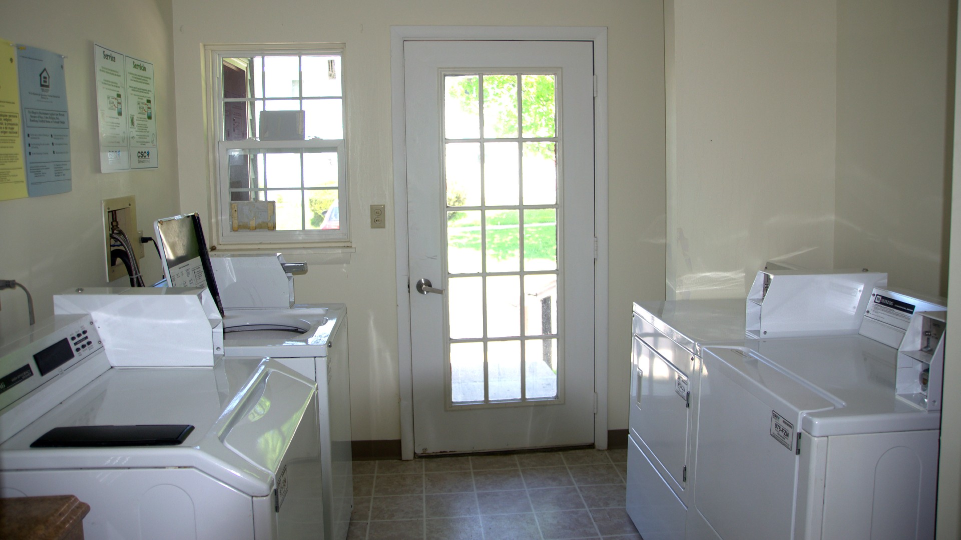 Senior Apartments near Avon NY image of community manor II laundry room from two plus four management